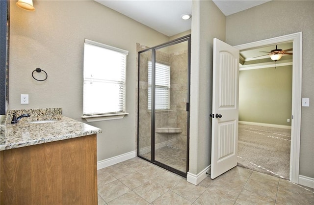 145 Rosemeade Dr, Farmington, AR 72730 - full bath featuring tile patterned flooring, a stall shower, vanity, and ceiling fan