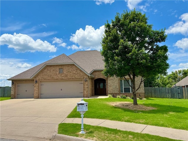 145 Rosemeade Dr, Farmington, AR 72730 - traditional-style home featuring a garage, driveway, brick siding, and roof with shingles