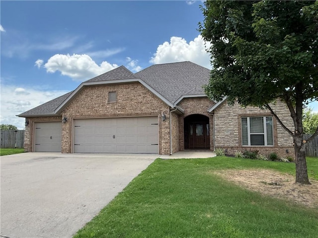 145 Rosemeade Dr, Farmington, AR 72730 - view of front of home with an attached garage, driveway, roof with shingles, and brick siding