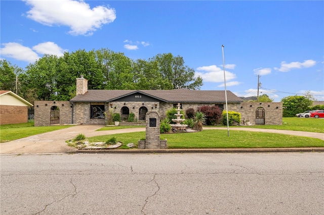 603 Thomas Blvd, Springdale, AR 72762 - view of front of property with curved driveway, a chimney, and a front lawn