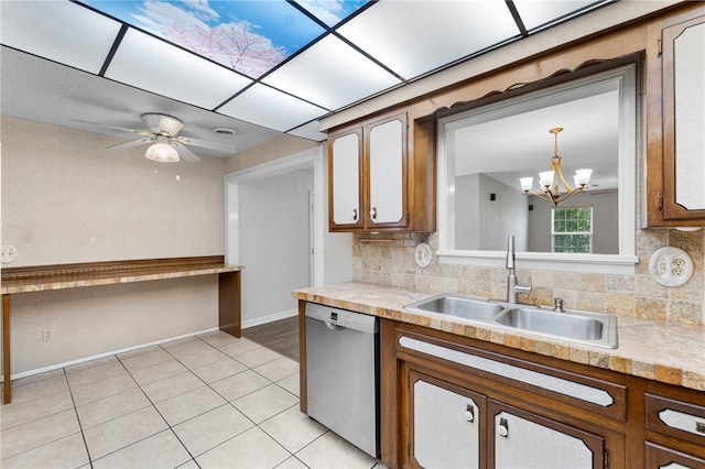 603 Thomas Blvd, Springdale, AR 72762 - kitchen featuring dishwasher, a chandelier, backsplash, and light tile patterned flooring