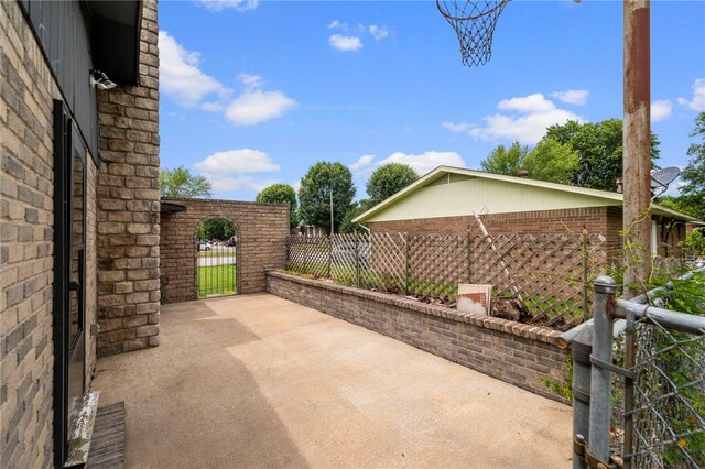603 Thomas Blvd, Springdale, AR 72762 - view of patio featuring a gate