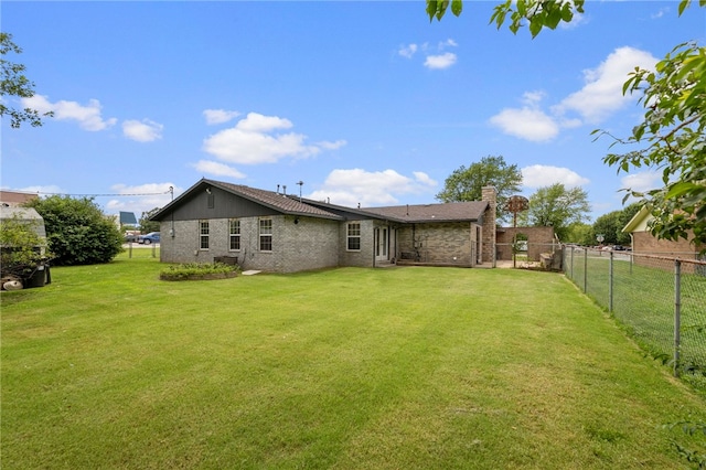 603 Thomas Blvd, Springdale, AR 72762 - back of property with a fenced backyard, brick siding, and a chimney