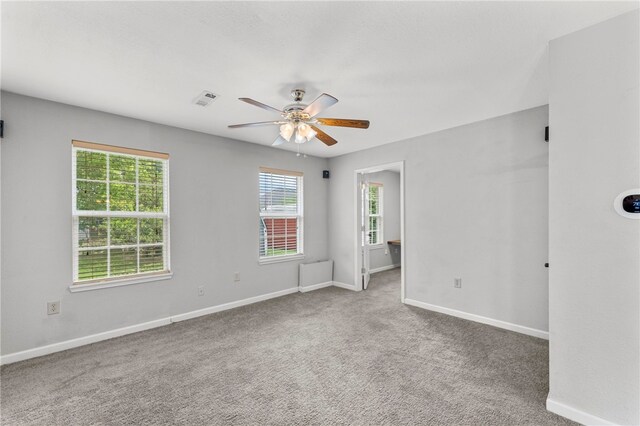 603 Thomas Blvd, Springdale, AR 72762 - carpeted empty room featuring ceiling fan and baseboards