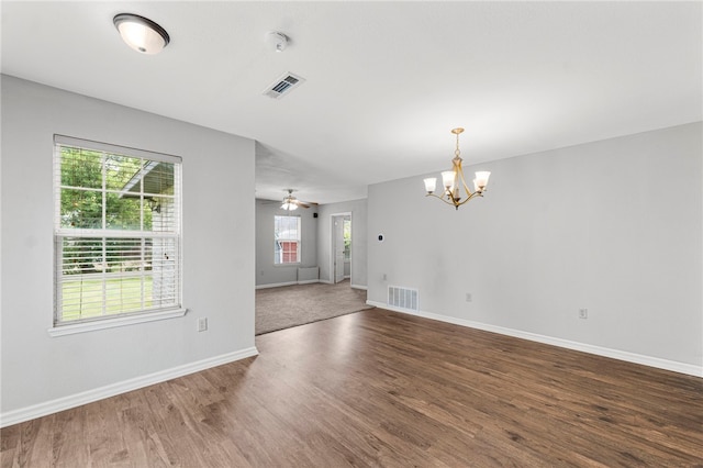 603 Thomas Blvd, Springdale, AR 72762 - unfurnished room featuring a chandelier, wood finished floors, and a smoke detector
