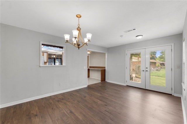 603 Thomas Blvd, Springdale, AR 72762 - unfurnished dining area with a chandelier, wood finished floors, and french doors