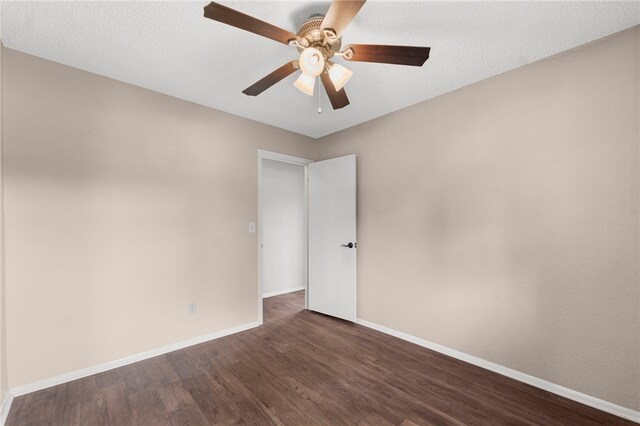 603 Thomas Blvd, Springdale, AR 72762 - empty room featuring dark wood-type flooring and ceiling fan