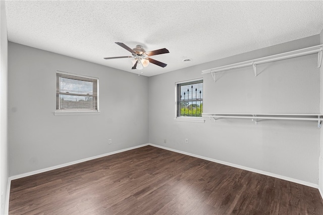 603 Thomas Blvd, Springdale, AR 72762 - unfurnished bedroom with multiple windows, wood finished floors, a textured ceiling, ceiling fan, and a closet