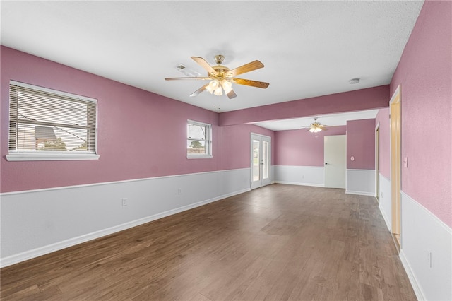 603 Thomas Blvd, Springdale, AR 72762 - empty room featuring a ceiling fan, wood finished floors, and a smoke detector