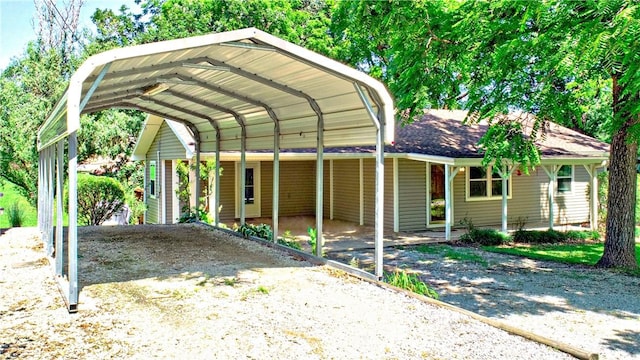 19135 Shoreline Way, Fayetteville, AR 72703 - view of parking with a carport and driveway