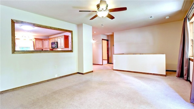 19135 Shoreline Way, Fayetteville, AR 72703 - spare room featuring ceiling fan and light carpet