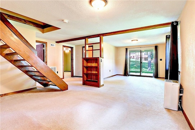 19135 Shoreline Way, Fayetteville, AR 72703 - unfurnished living room featuring light carpet, stairway, and a textured ceiling