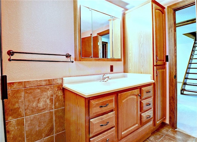 19135 Shoreline Way, Fayetteville, AR 72703 - bathroom with vanity, a textured wall, and tile patterned floors