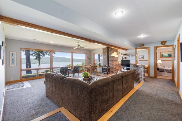 188 Point Mirage Rd, Eureka Springs, AR 72631 - living area with a wood stove, light colored carpet, ceiling fan, and recessed lighting