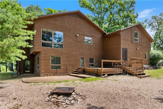 188 Point Mirage Rd, Eureka Springs, AR 72631 - rear view of house featuring a deck and a patio