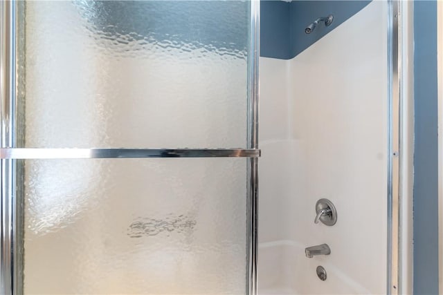 188 Point Mirage Rd, Eureka Springs, AR 72631 - bathroom featuring bath / shower combo with glass door