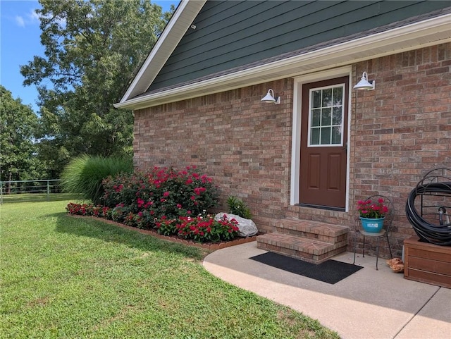 1445 Woodhaven Ln, Harrison, AR 72601 - doorway to property featuring a yard and brick siding