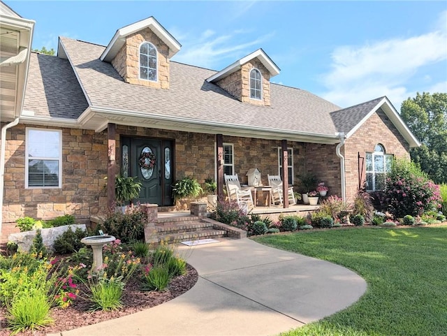 1445 Woodhaven Ln, Harrison, AR 72601 - view of front of house featuring a porch, a shingled roof, a front lawn, and stone siding