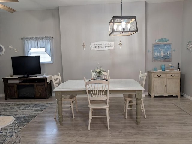 1445 Woodhaven Ln, Harrison, AR 72601 - dining room featuring wood finished floors, a chandelier, and ceiling fan