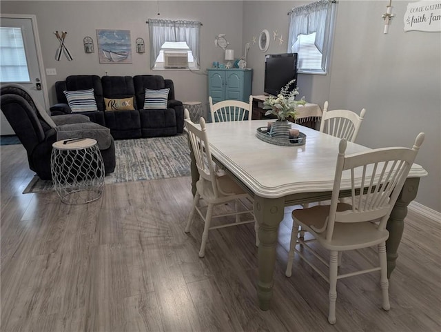 1445 Woodhaven Ln, Harrison, AR 72601 - dining area with wood finished floors and healthy amount of natural light