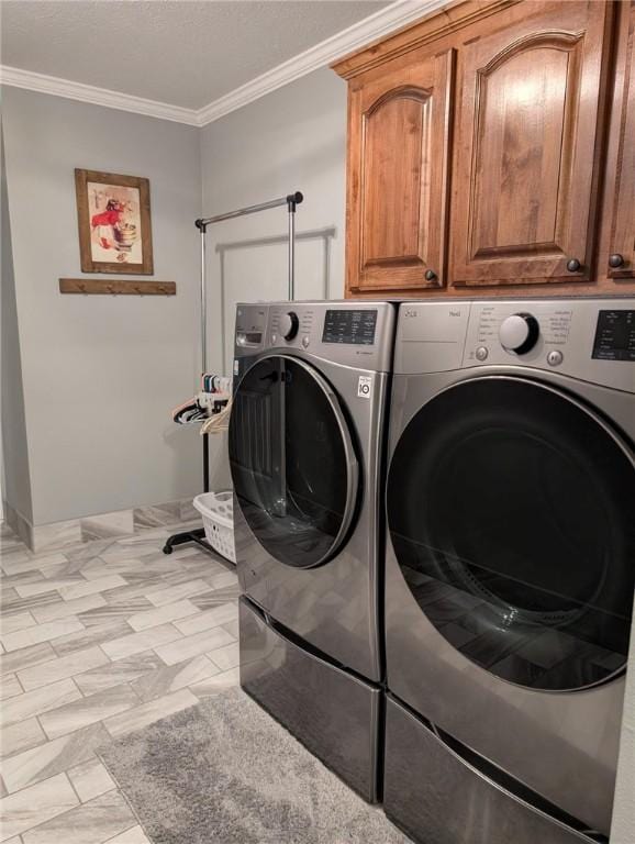 1445 Woodhaven Ln, Harrison, AR 72601 - laundry area featuring washer and clothes dryer, crown molding, and cabinet space
