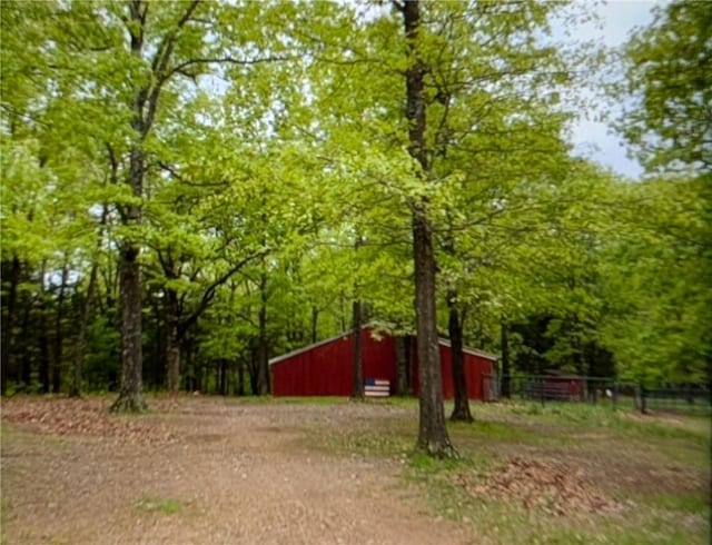 1445 Woodhaven Ln, Harrison, AR 72601 - view of yard with a pole building, an outdoor structure, and a wooded view