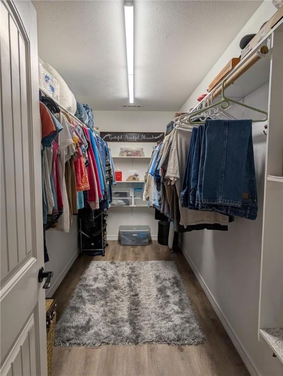 1445 Woodhaven Ln, Harrison, AR 72601 - walk in closet with wood finished floors