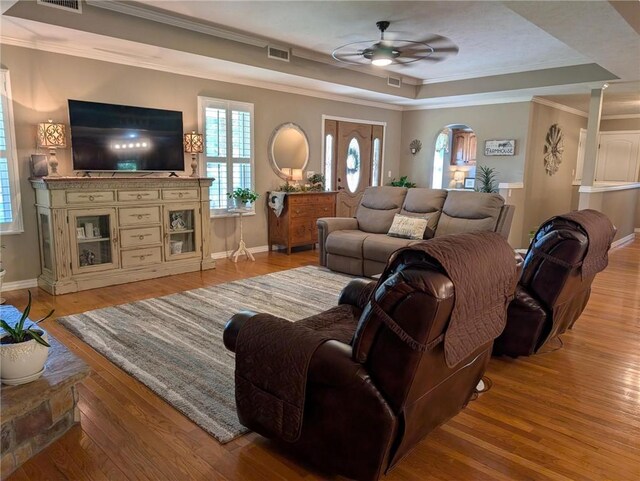 1445 Woodhaven Ln, Harrison, AR 72601 - living area with a tray ceiling, a ceiling fan, light wood-style flooring, and ornamental molding