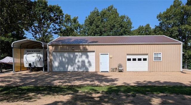 1445 Woodhaven Ln, Harrison, AR 72601 - garage featuring a detached garage and a carport