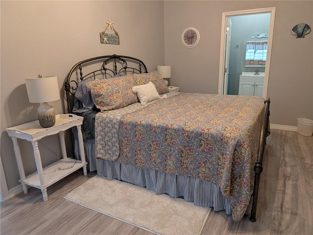 1445 Woodhaven Ln, Harrison, AR 72601 - bedroom featuring wood finished floors and baseboards