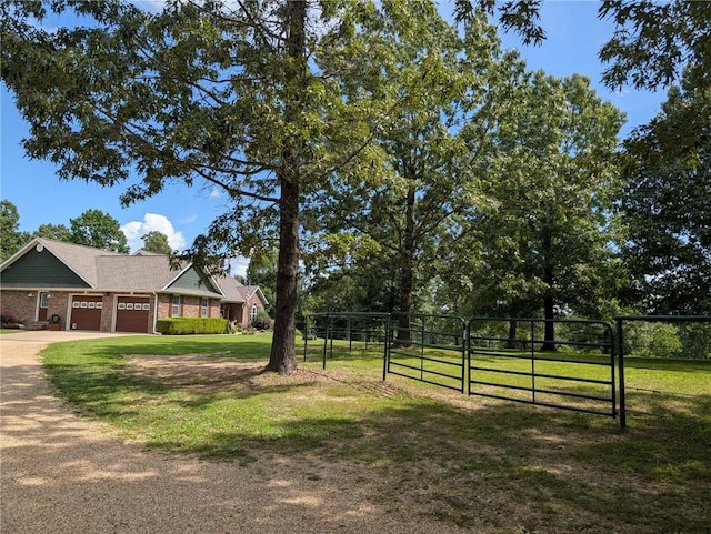 1445 Woodhaven Ln, Harrison, AR 72601 - view of yard featuring a gate, a garage, and driveway