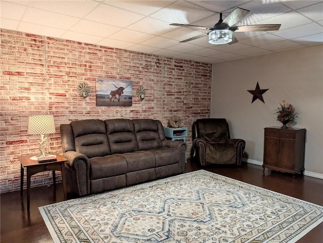 1445 Woodhaven Ln, Harrison, AR 72601 - living room with ceiling fan, brick wall, and dark wood-style floors