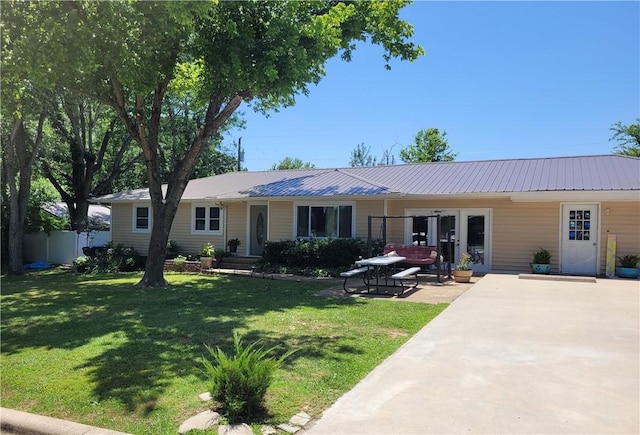 400 Franklin St, Harrison, AR 72601 - ranch-style house with a metal roof and french doors