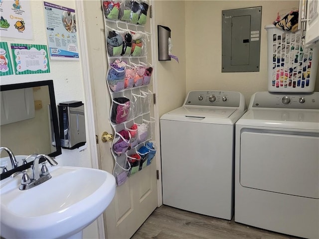 400 Franklin St, Harrison, AR 72601 - laundry room with electric panel, wood finished floors, and washer and clothes dryer
