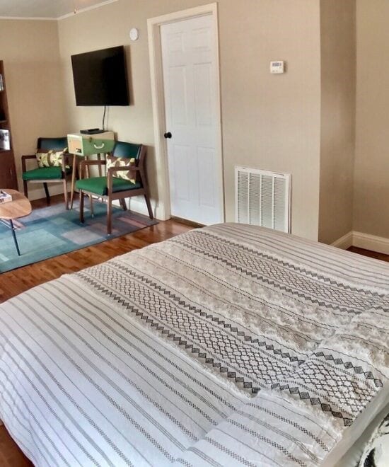 151 W Van Buren, Eureka Springs, AR 72632 - bedroom with wood finished floors and crown molding
