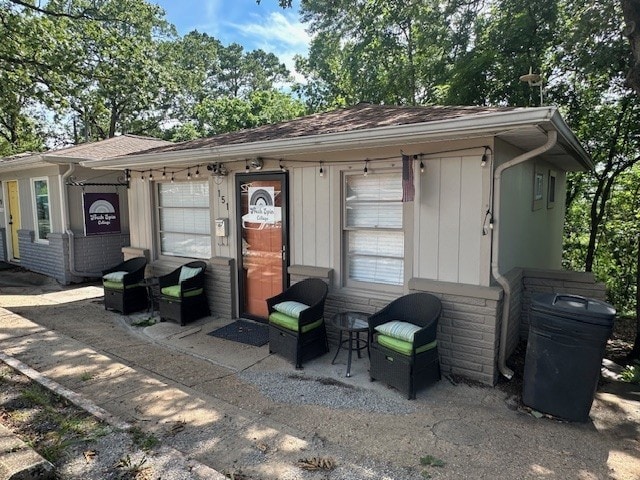 151 W Van Buren, Eureka Springs, AR 72632 - view of front of house featuring roof with shingles and a patio