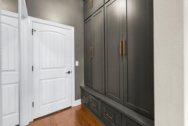 1200 Birkshire Cir, Cave Springs, AR 72718 - mudroom featuring dark wood-style floors and a textured wall