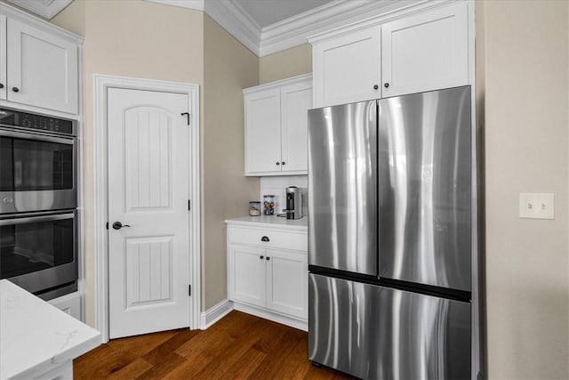 1200 Birkshire Cir, Cave Springs, AR 72718 - kitchen featuring stainless steel appliances, ornamental molding, dark wood-type flooring, white cabinetry, and light stone counters