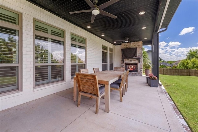 1200 Birkshire Cir, Cave Springs, AR 72718 - view of patio / terrace with an outdoor brick fireplace, a ceiling fan, and outdoor dining area