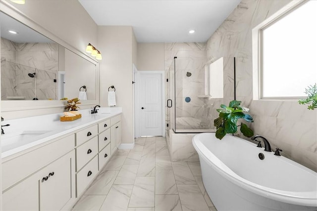 1200 Birkshire Cir, Cave Springs, AR 72718 - full bath featuring a marble finish shower, a freestanding tub, double vanity, marble look tiles, and recessed lighting