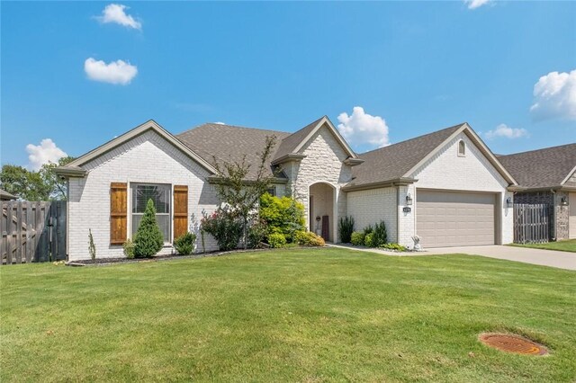 4278 W Anthem Dr, Fayetteville, AR 72704 - view of front of house with brick siding, a garage, and concrete driveway