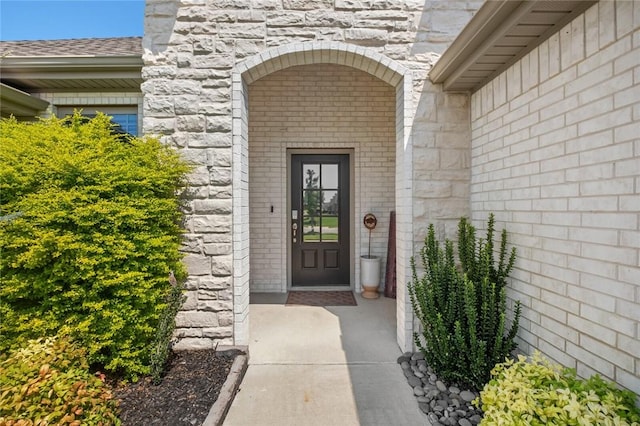 4278 W Anthem Dr, Fayetteville, AR 72704 - property entrance with stone siding and brick siding