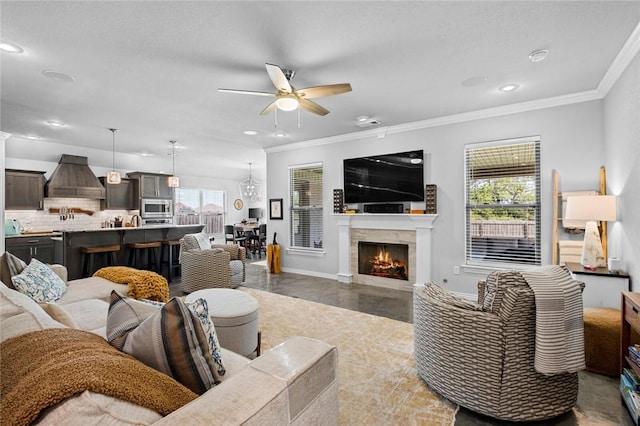 4278 W Anthem Dr, Fayetteville, AR 72704 - living area featuring plenty of natural light, ceiling fan, crown molding, recessed lighting, and a lit fireplace