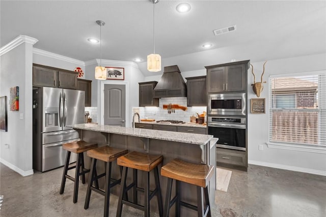 4278 W Anthem Dr, Fayetteville, AR 72704 - kitchen featuring appliances with stainless steel finishes, concrete floors, premium range hood, dark brown cabinetry, and ornamental molding