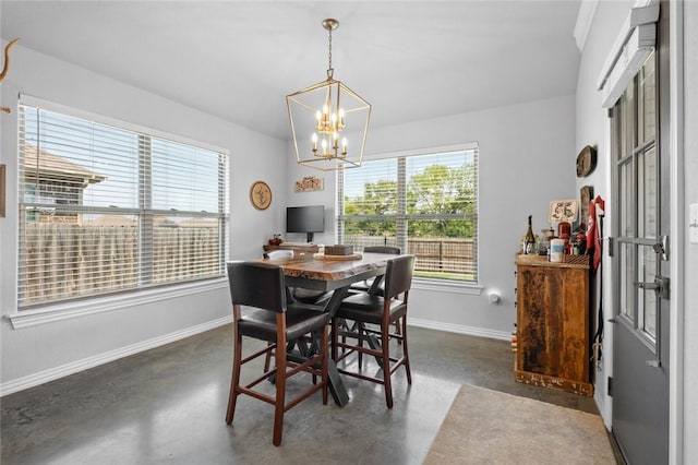 4278 W Anthem Dr, Fayetteville, AR 72704 - dining area with concrete flooring and a chandelier