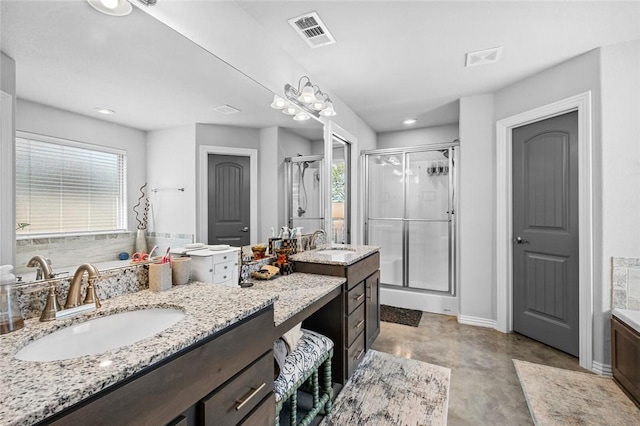 4278 W Anthem Dr, Fayetteville, AR 72704 - bathroom with a shower stall, two vanities, concrete flooring, and recessed lighting