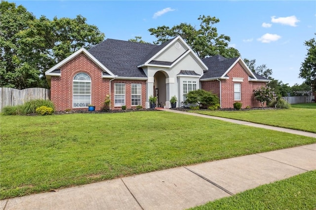 1112 N Oriole Ave, Rogers, AR 72756 - traditional-style home featuring brick siding, stucco siding, and roof with shingles