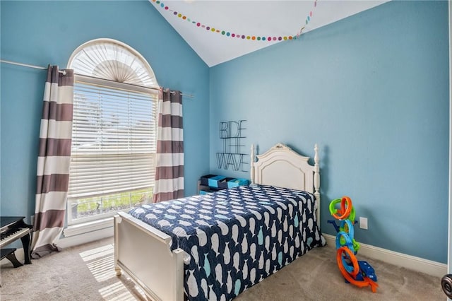 1112 N Oriole Ave, Rogers, AR 72756 - carpeted bedroom with vaulted ceiling and baseboards