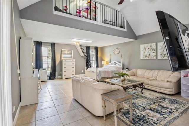 1112 N Oriole Ave, Rogers, AR 72756 - living area with light tile patterned floors, high vaulted ceiling, and ceiling fan