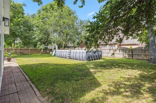 1112 N Oriole Ave, Rogers, AR 72756 - fenced backyard featuring a playground